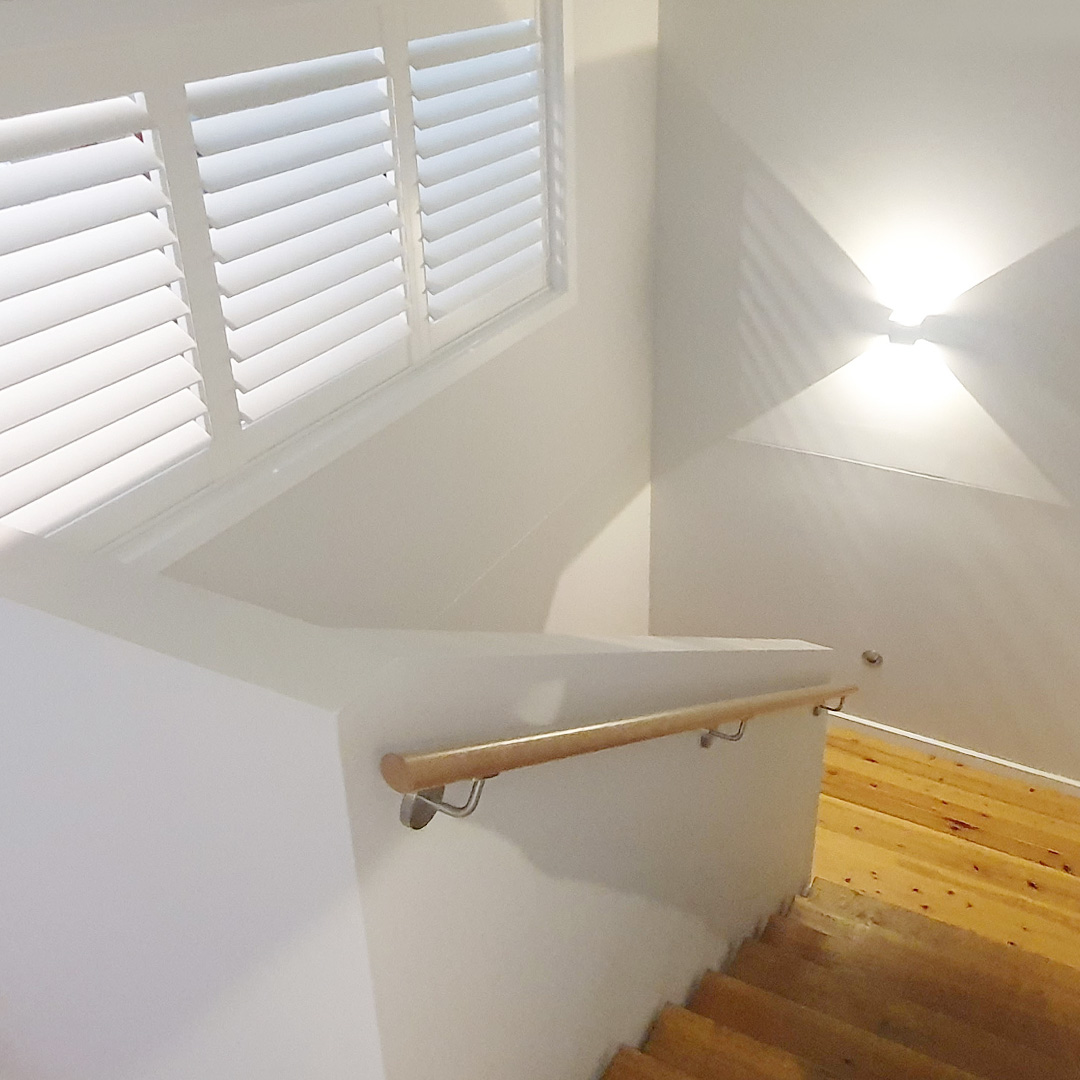 Internal staircase featuring a Plantation Shutter above the stairs, looking through to the home office.